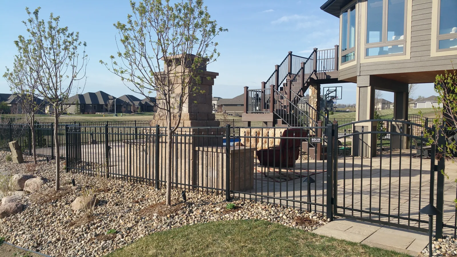 Black ornamental steel security fence and matching gate
