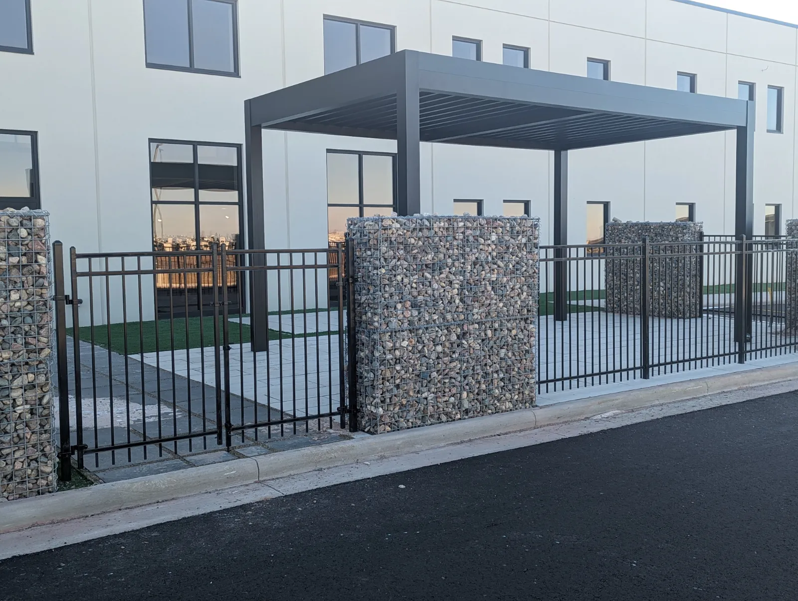 Commercial patio enclosures with steel posts and gates